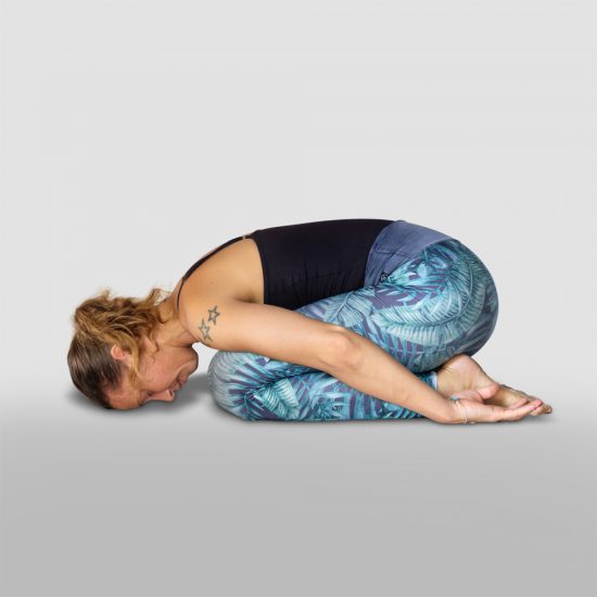 demonstration of Child pose, Balasana in sanskrit