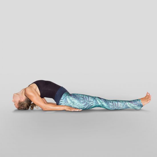 demonstration of Fish Pose, Matsyasana in sanskrit