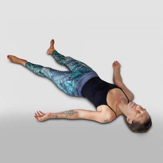 demonstration of Corpse pose, Shavasana in sanskrit