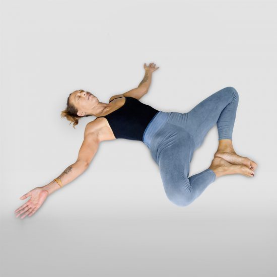 demonstration of Reclining bound angle pose or Supta Baddha konasana in sanskrit