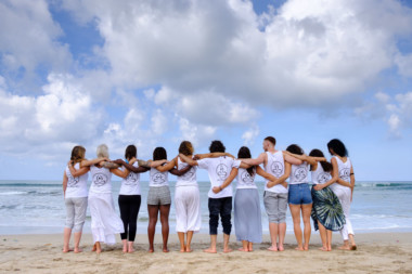 yoga teacher training student on the beach after certification