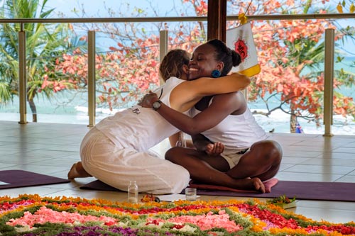 Certification hug of a student during a Yoga teacher training in Bali